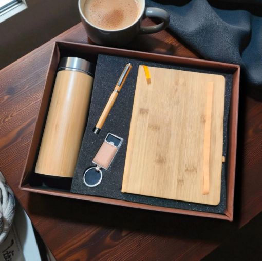 Picture of NEW YEAR DIARY WOODEN 2026 WITH A PEN ,A BOTTLE AND A KEY RING