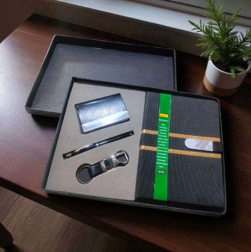 Picture of NEW YEAR DIARY 2026 WITH A PEN ,A KEY CHAIN AND A CARD HOLDER.